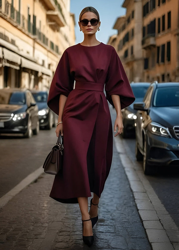 Women's elegant flowy maxi dress with a flattering belt, perfect for versatile occasion wear.