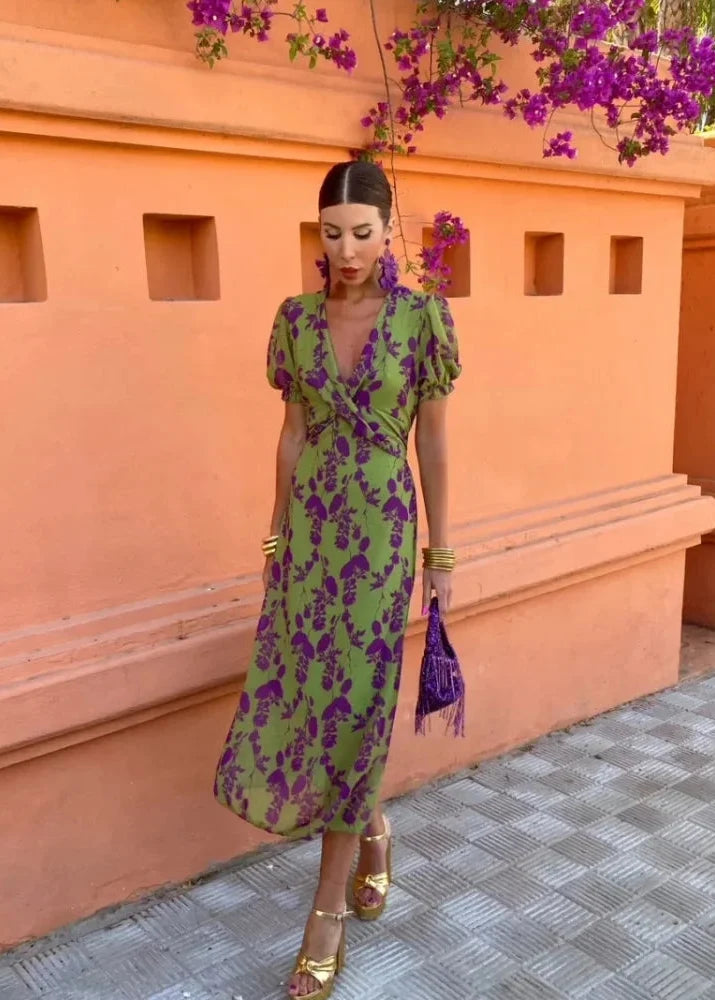 Green floral women's midi dress with chic puff sleeves and a sophisticated wrap V-neck. Ideal for elegant party wear.
