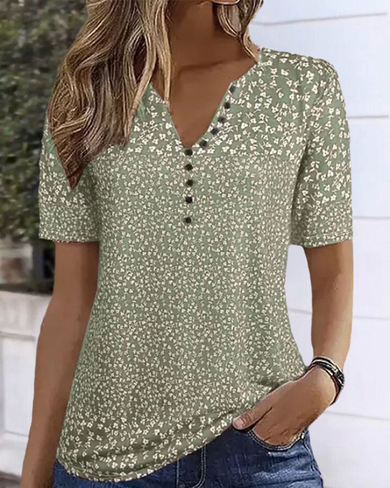 Women's elegant green floral short-sleeve shirt. Stylish, breathable summer top with a relaxed fit.