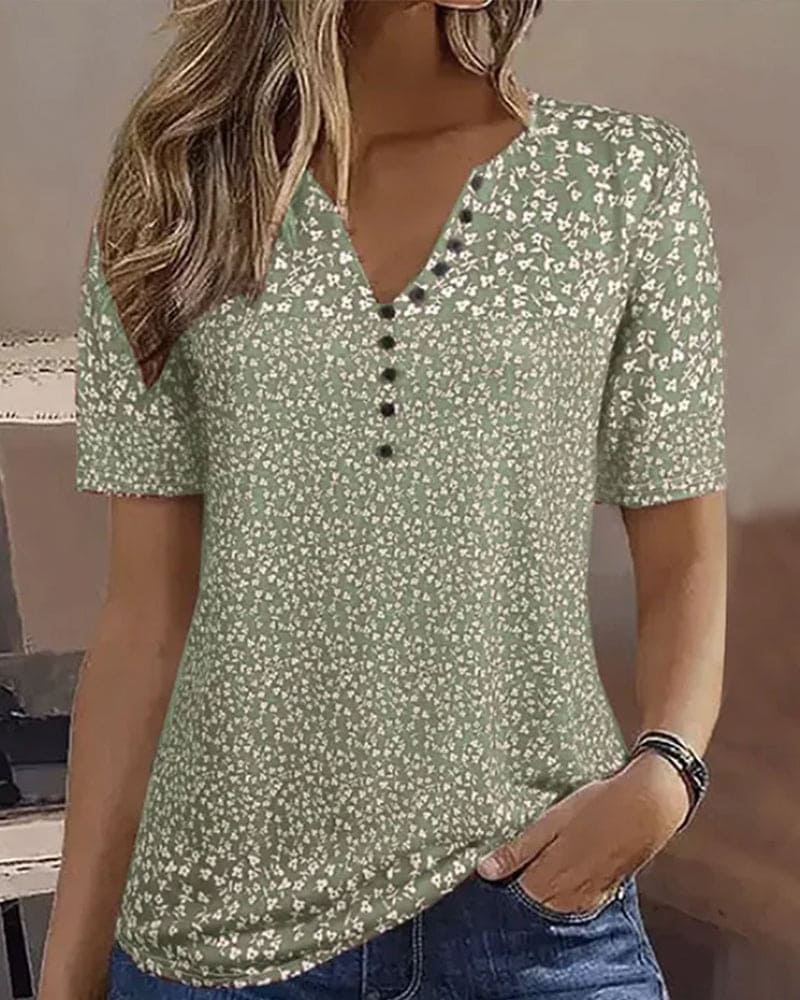 Stylish women's green floral summer blouse. Comfortable short-sleeve top for casual wear.