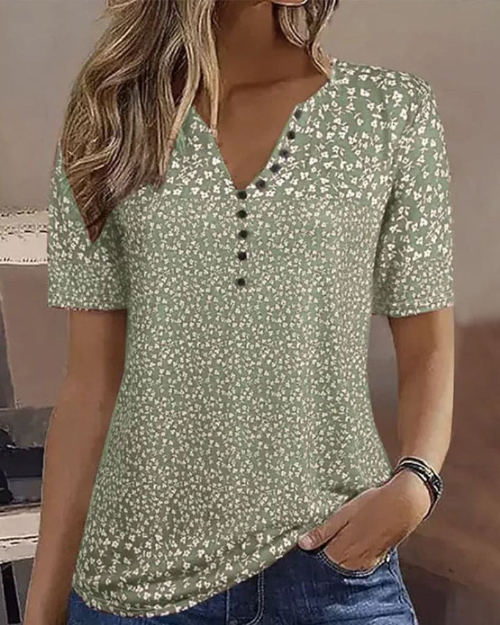 Stylish women's green floral summer blouse. Comfortable short-sleeve top for casual wear.