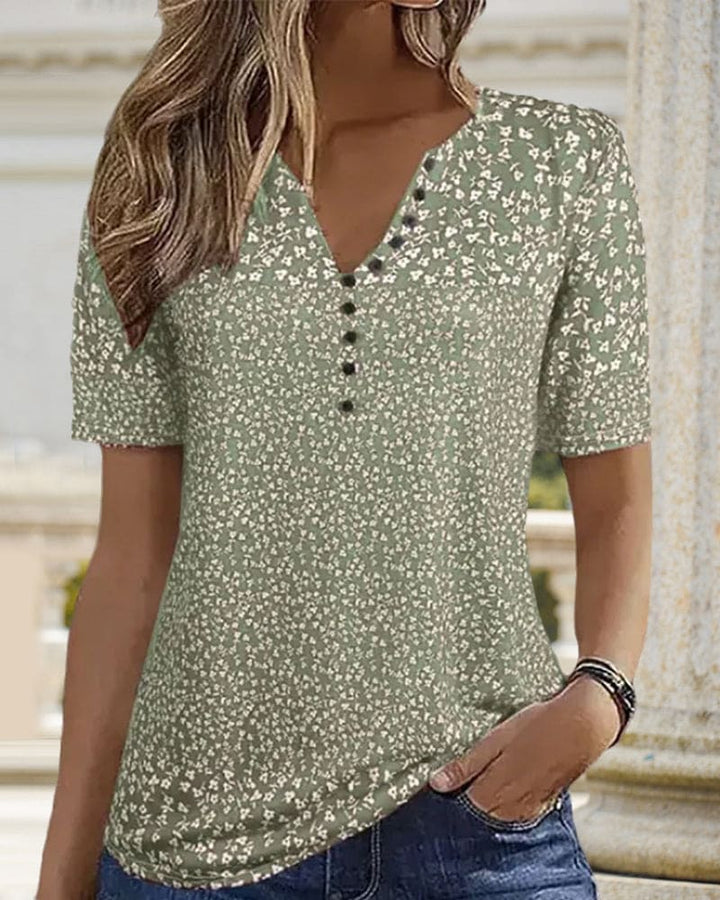 Comfortable & stylish green floral women's shirt. Perfect short-sleeve summer top with an elegant design.