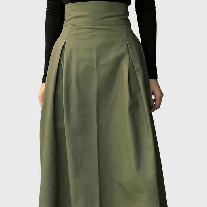 Chic women's high-waist green pleated midi skirt, an elegant and versatile addition to any wardrobe.