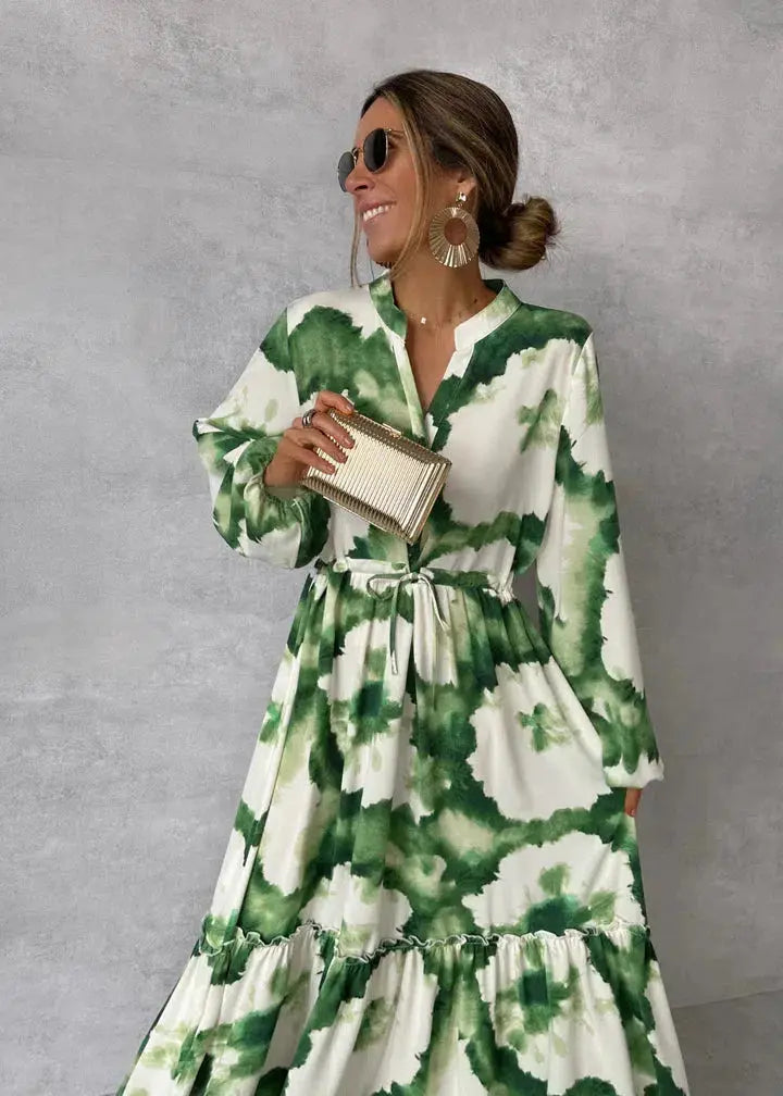 Women's elegant green maxi dress with puff sleeves, V-neck, and tie waist for formal events or wedding guests.
