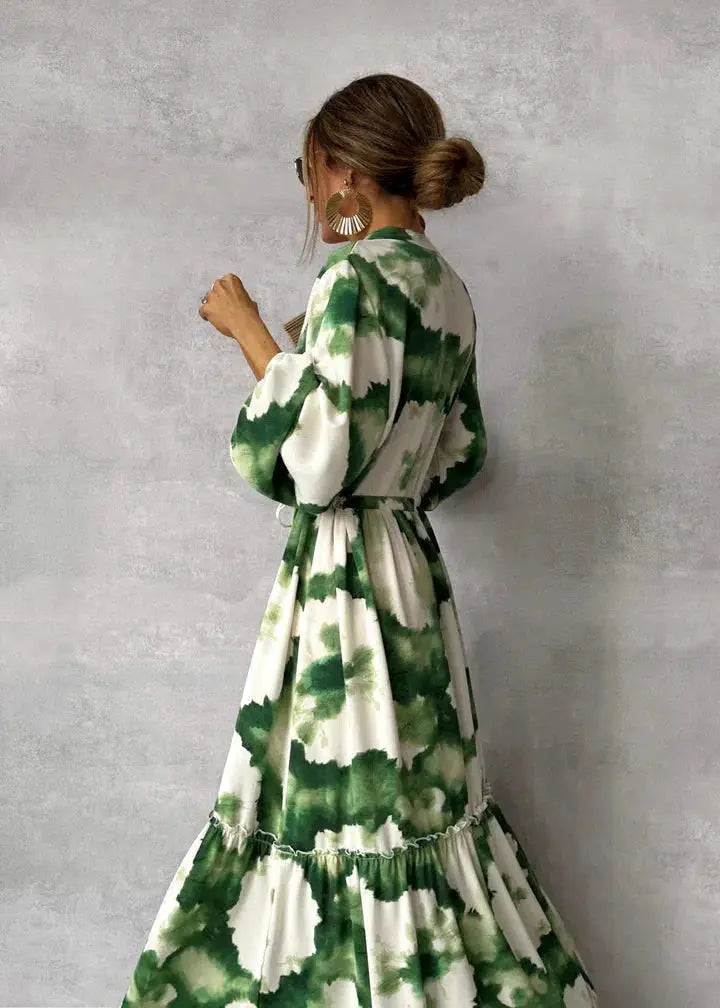 Elegant long green evening dress for women, a formal gown with puff sleeves and V-neck, ideal for special occasions.