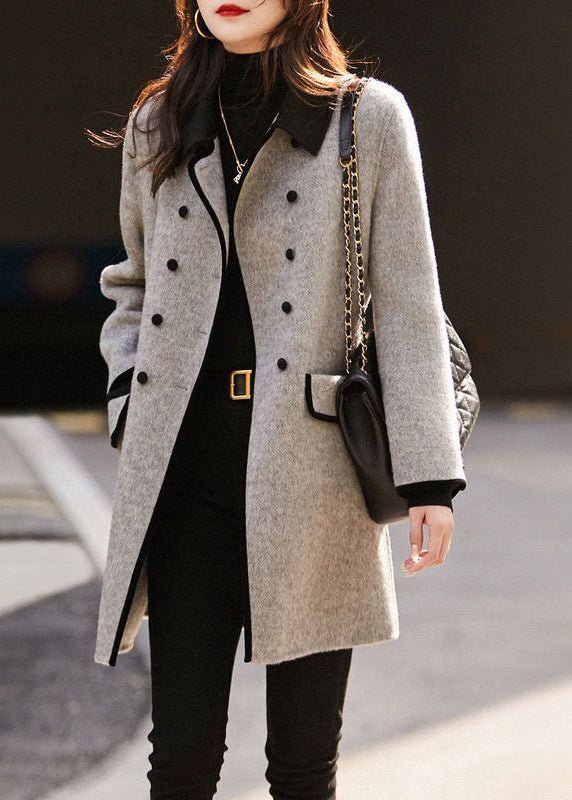 Women's elegant grey tailored winter coat, long sleeve, sophisticated style, perfect for formal or casual chic outfits.