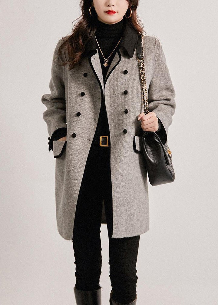 Stylish women's grey tailored winter outerwear, offering warm comfort & classic design for elegant autumn & winter fashion.