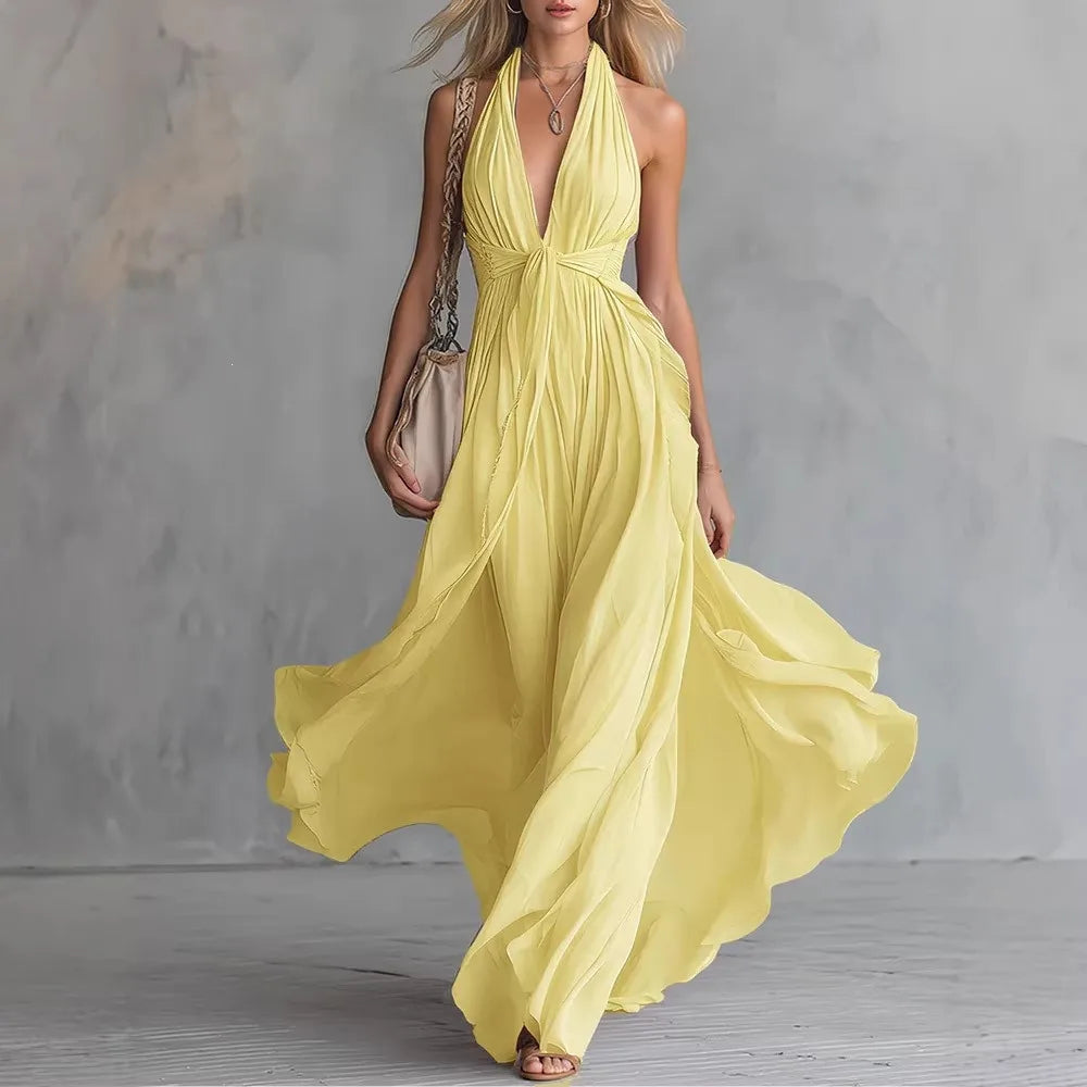 Stylish women's halter maxi dress featuring a chic backless design, pleated detailing, and high side slit.