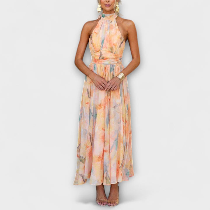 Women's elegant halter maxi dress with vibrant watercolor print, perfect for summer special occasions and vacation.