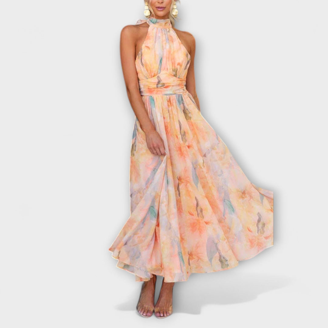 Stylish women's halter neck maxi dress for elegant summer events, featuring a beautiful watercolor design.