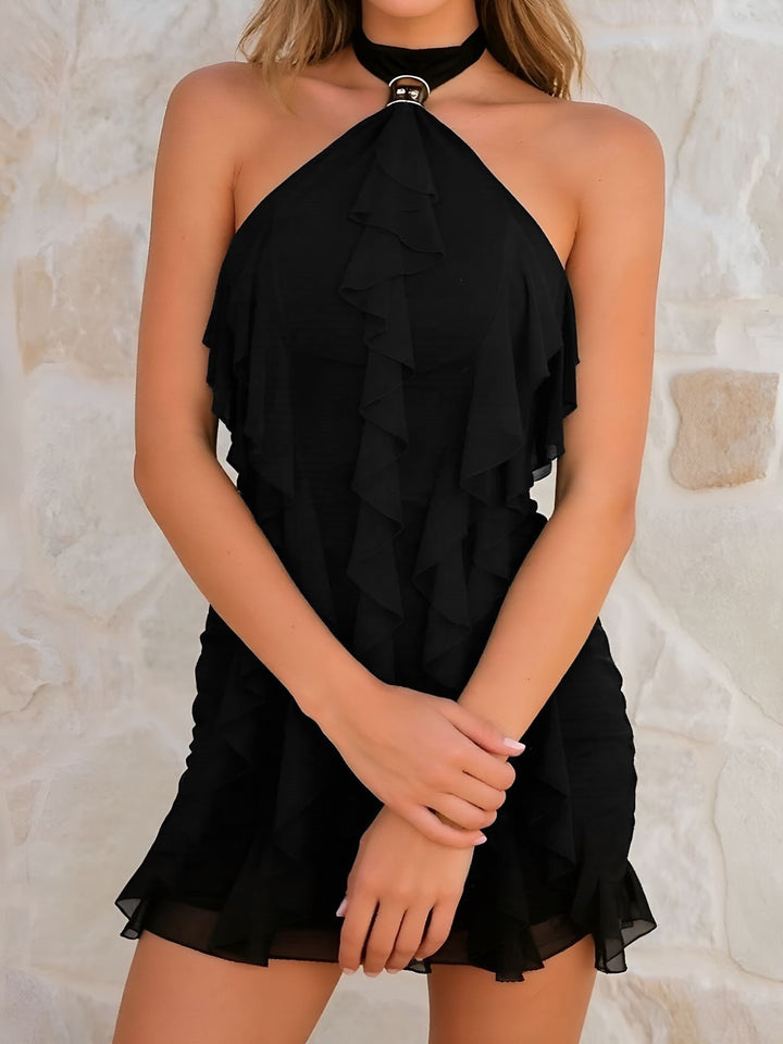 Women's pretty tiered ruffle mini dress. Features a stylish halter neckline and a figure-hugging bodycon fit.
