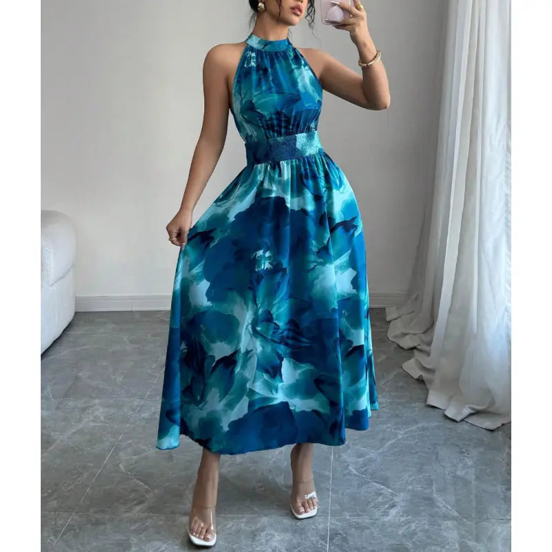 Flattering women's casual halter neck long maxi dress. Features a comfortable smocked waist and stylish abstract print.