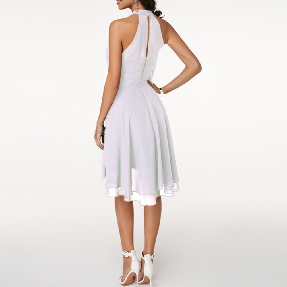 Chic women's mini dress featuring a flattering halter neck design, ideal for summer evenings.
