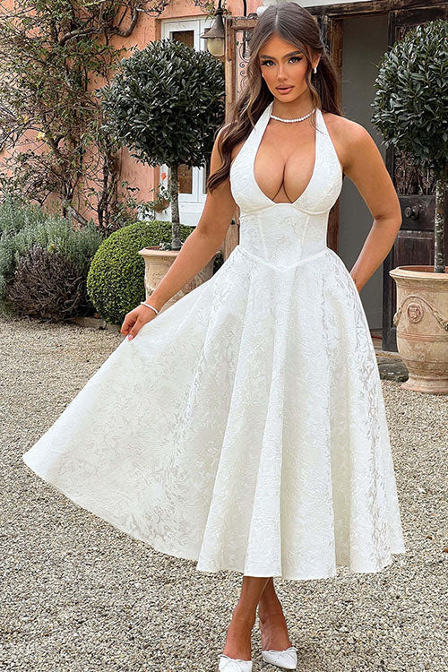 Flowy skirt of a women's A-line maxi dress with halterneck, showcasing its elegant movement for dancing.