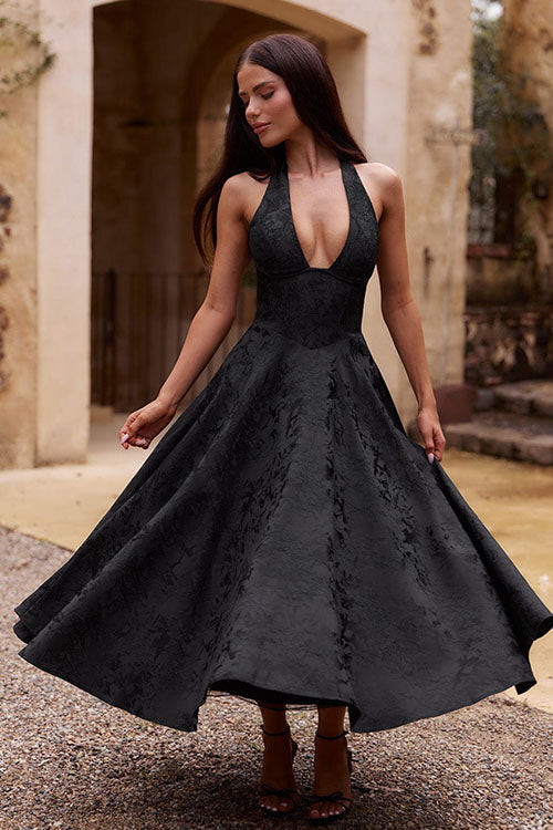 Women modeling an elegant A-line maxi dress with a halterneck. Perfect for formal and special occasions.