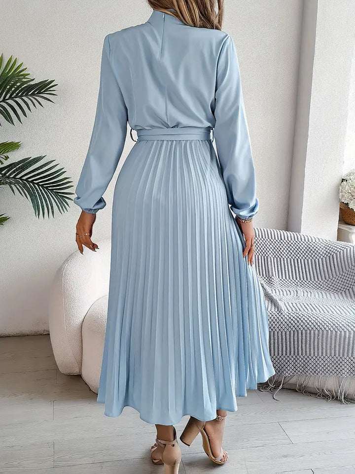 Stylish A-line pleated midi dress for women, featuring a chic belt & long sleeves. Versatile design.