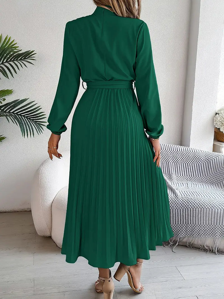 Classic women's belted long sleeve midi dress with pleats, ideal for sophisticated office or event wear.