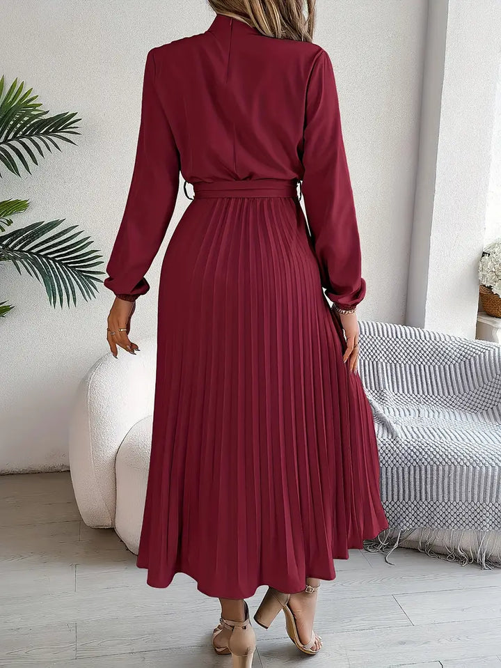 Elegant A-line pleated midi dress for women with long sleeves & belt. A versatile fashion statement.