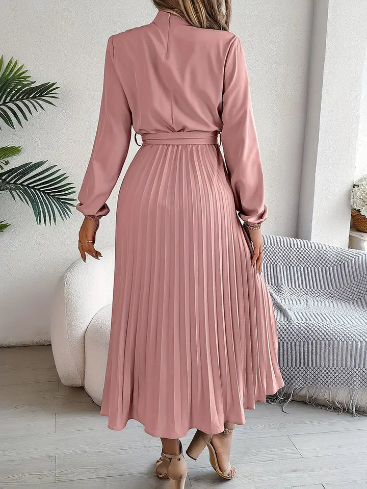 Sophisticated women's belted pleated midi dress with long sleeves, suitable for formal or casual occasions.