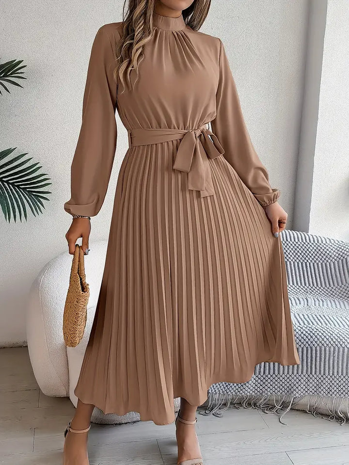 Belted A-line midi dress for women, with long sleeves & elegant pleats. A versatile fall/spring fashion staple.