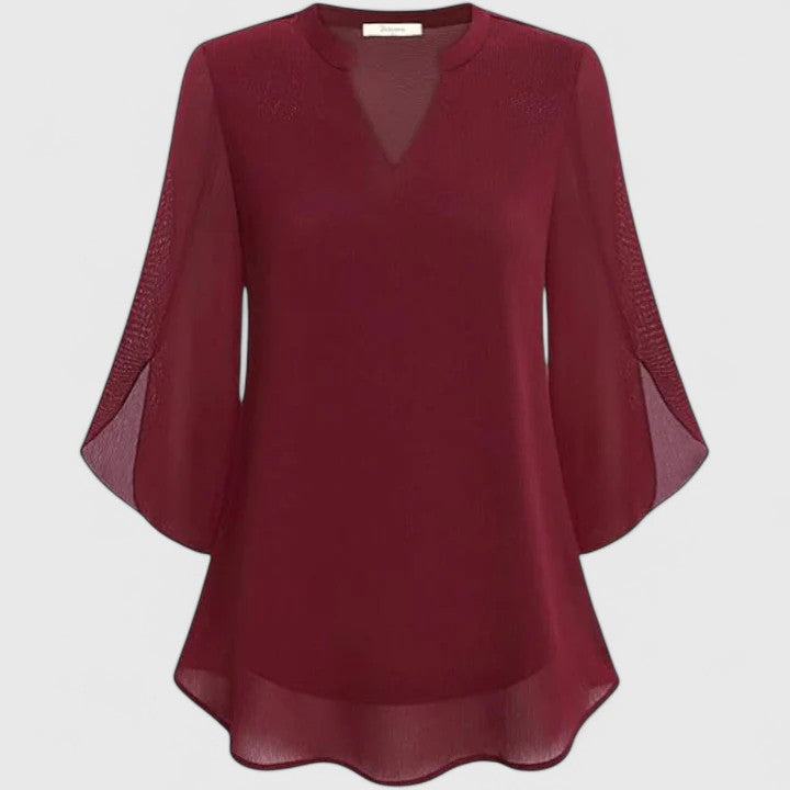 Elegant women's workwear blouse with long sleeves, a versatile piece for office fashion.