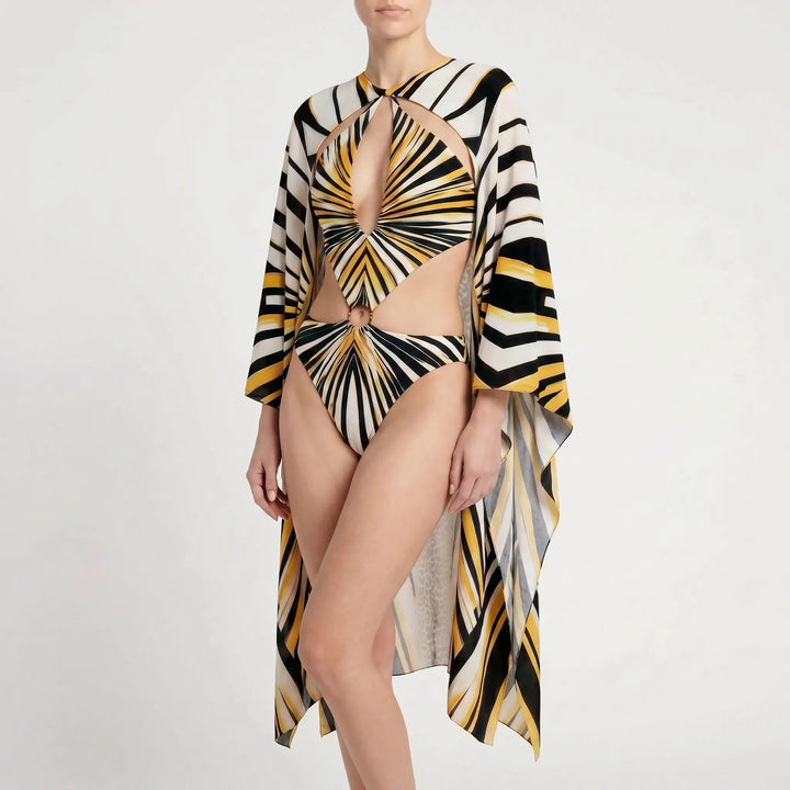 Stylish long-sleeve monokini with flared sleeves, plunge neck, and cutouts for resort wear.