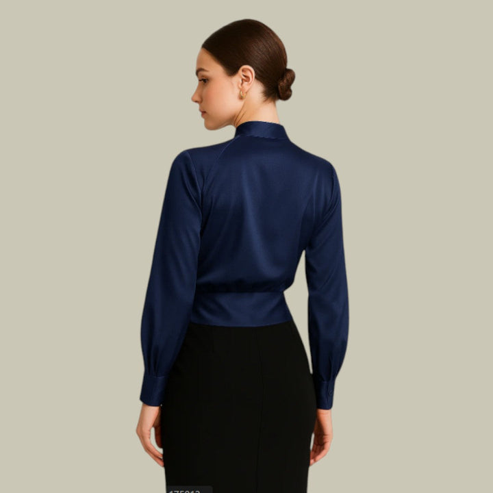 Chic women's wrap top with a satin finish, ideal for sophisticated style and versatile office-to-evening wear.