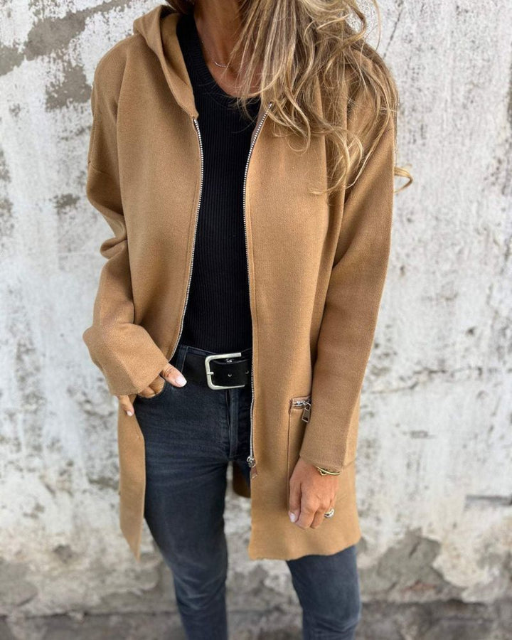 Comfortable women's long sleeve knit cardigan with a full-zip closure, blending elegance and ease.