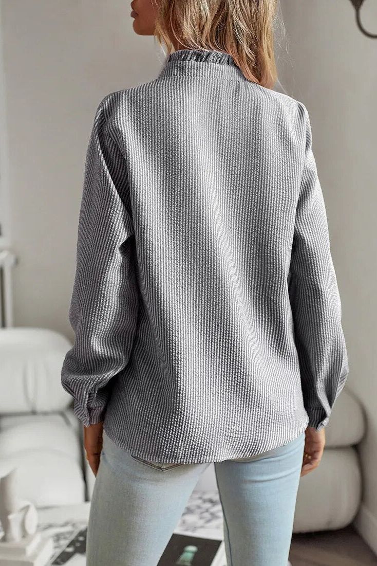 Polished women's longsleeve top, an elegant blouse suitable for office wear, work, or daily fashion.