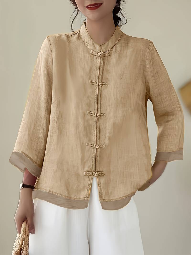 Sophisticated women's black mandarin collar blouse with distinctive frog buttons & 3/4 sleeves.