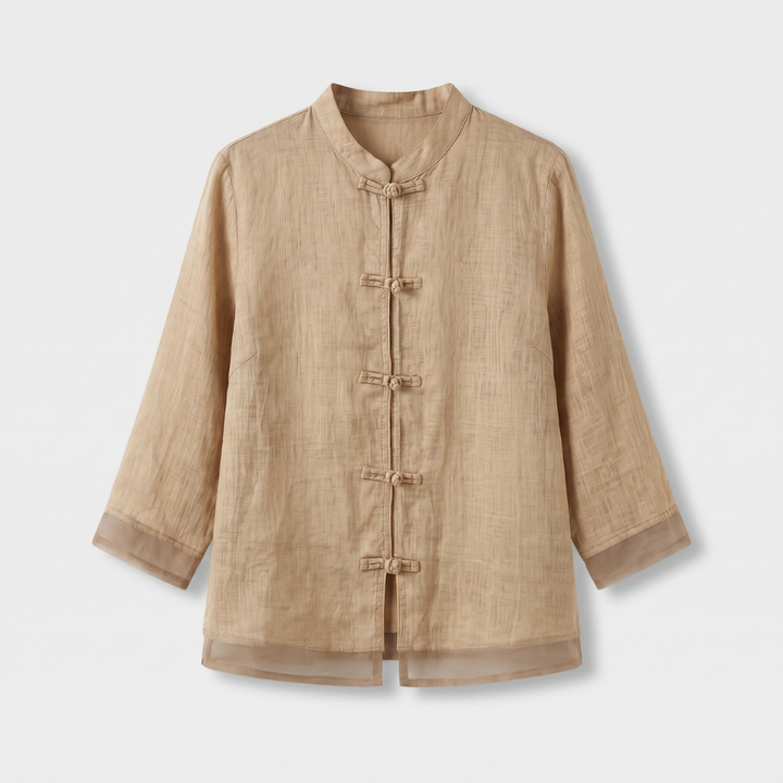Elegant women's blouse with a stand-up mandarin collar and traditional frog button fastening.