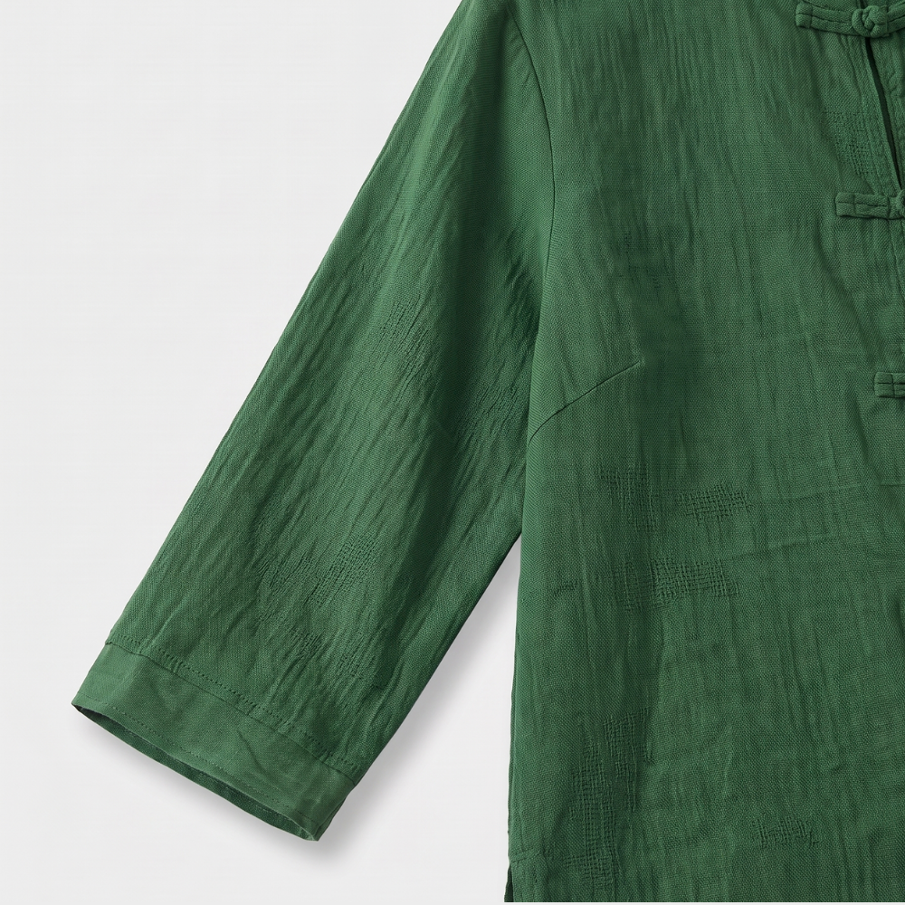 Crisp white women's office blouse with mandarin collar and elegant frog button detailing.
