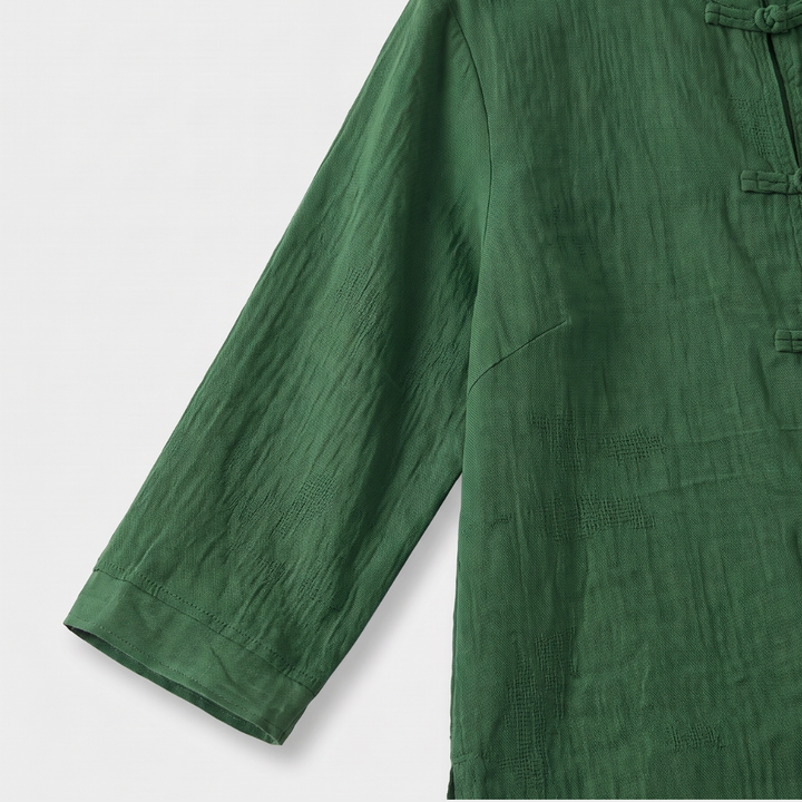 Crisp white women's office blouse with mandarin collar and elegant frog button detailing.