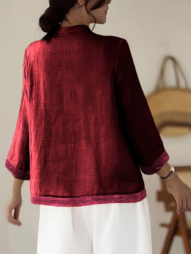 Stylish women's blouse with a sophisticated mandarin collar & unique frog button design, 3/4 sleeves.