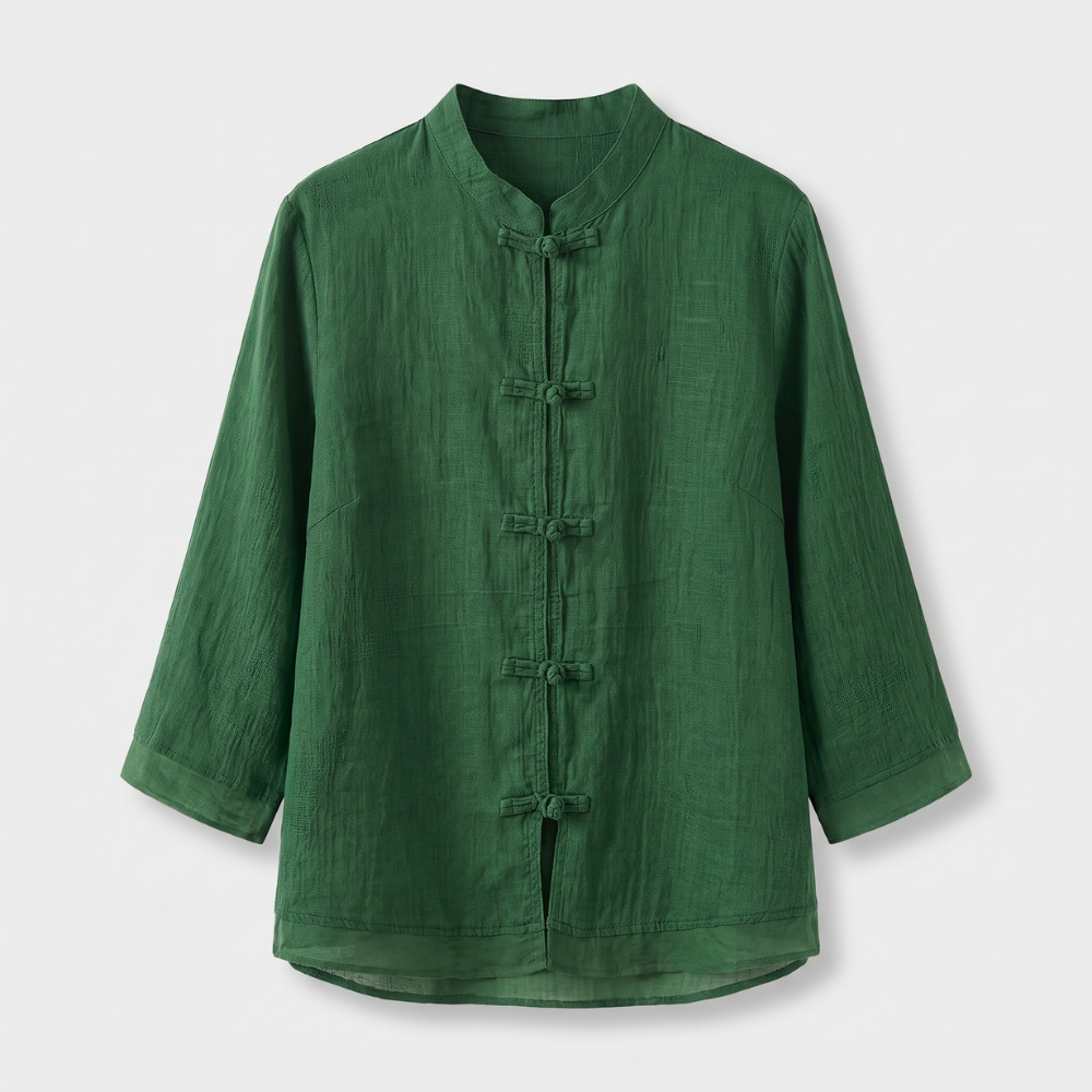 Sophisticated women's blouse featuring a mandarin collar and unique frog button closure.