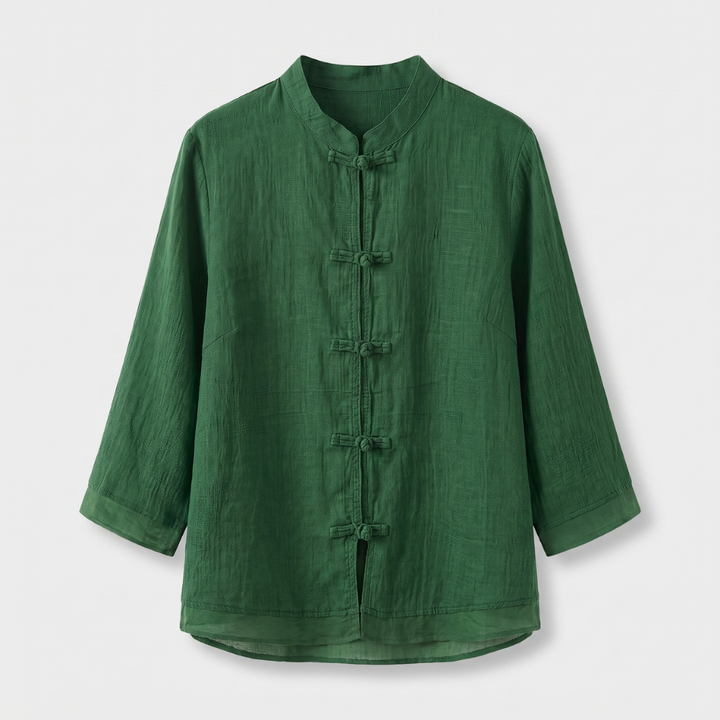 Sophisticated women's blouse featuring a mandarin collar and unique frog button closure.