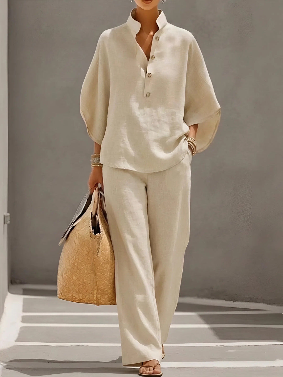 Sophisticated women's coordinated set with a mandarin collar top and flowing wide-leg pants.