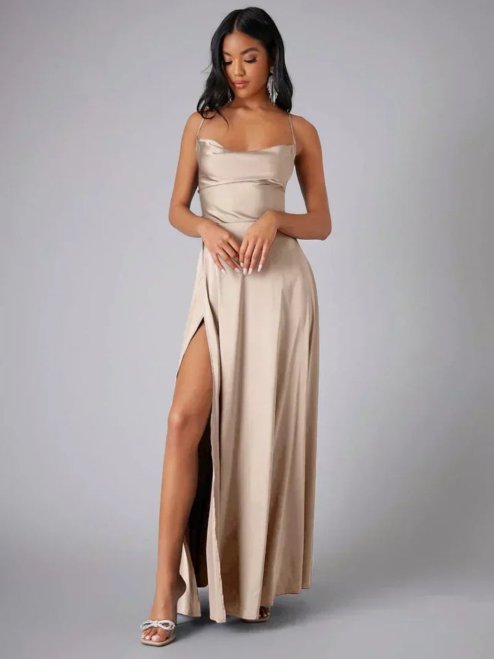Women's elegant maxi evening dress with a high slit & alluring open back, perfect for special occasions.