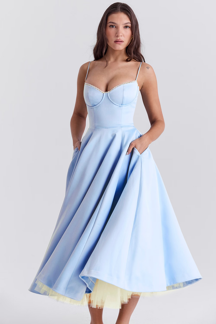 Sleeveless women's midi dress featuring a stylish lace-trim corset bodice, sweetheart neckline, & practical pockets.