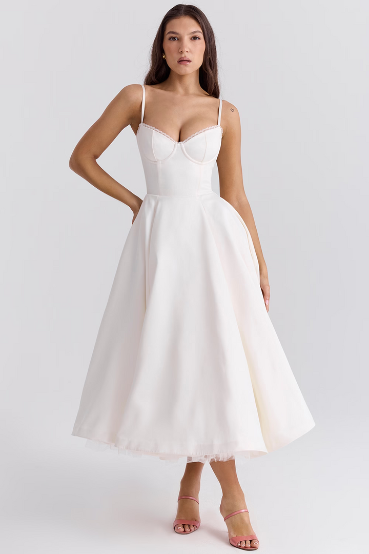 Chic women's sleeveless midi dress, featuring a corset bodice, delicate lace trim, and practical pockets.
