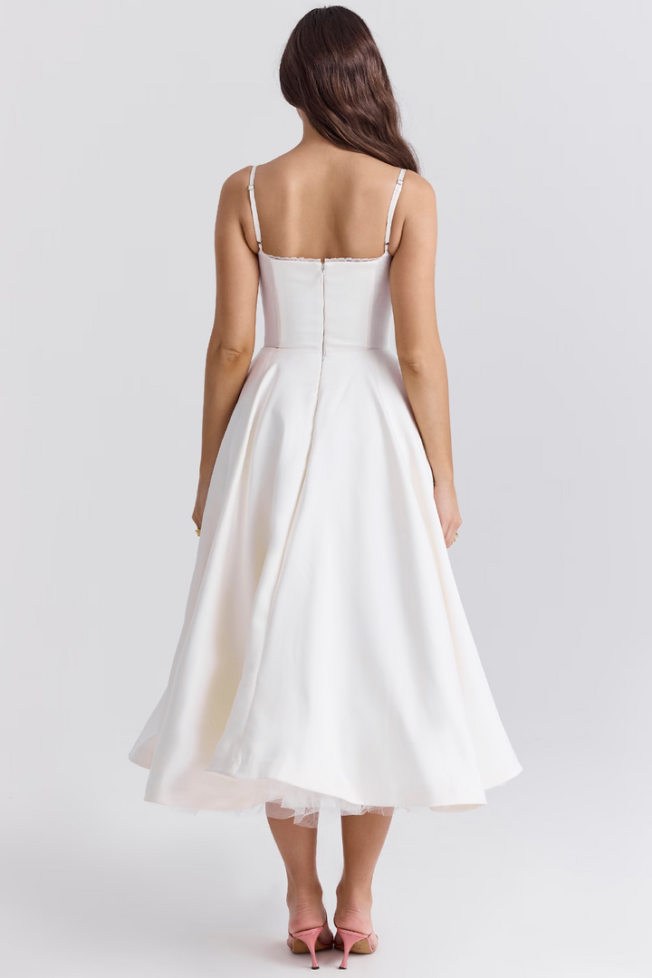 Stylish women's party midi dress, sleeveless, with a lace-trim corset, sweetheart neckline, and pockets.