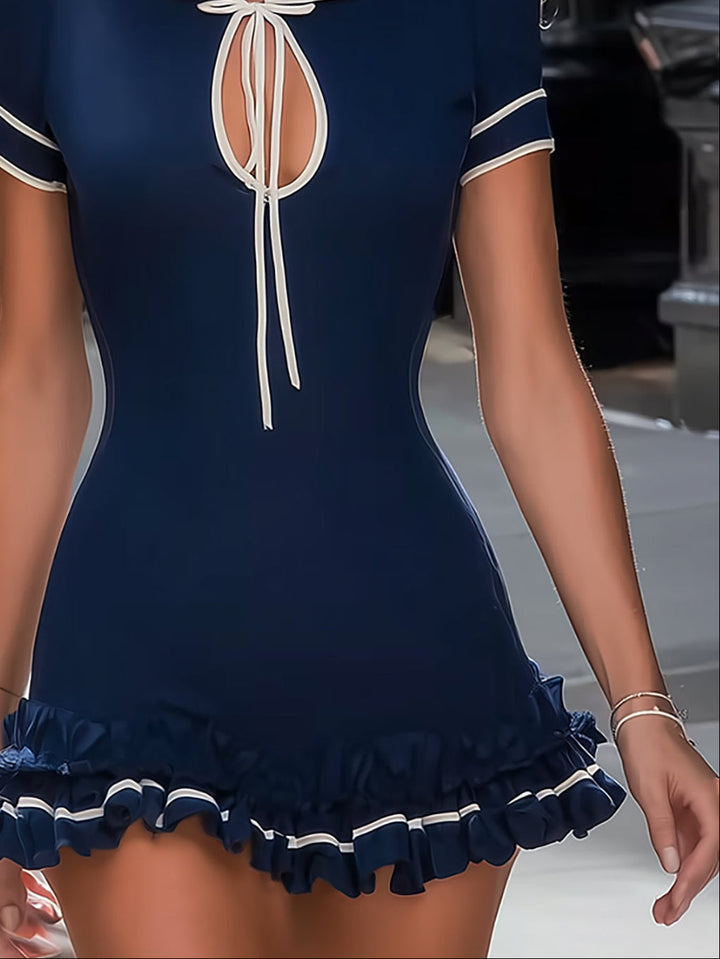 Elegant navy women's mini dress, designed with a sophisticated tie neck, short sleeves, and a fashionable ruffled hem.
