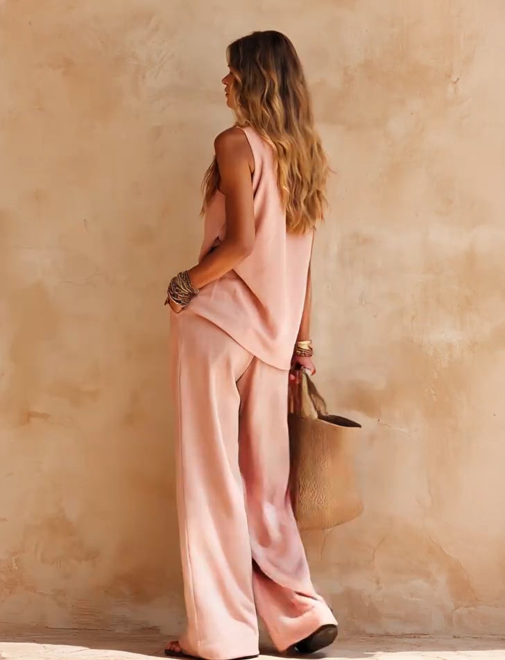 Chic women's one-shoulder jumpsuit with a flowing wide leg & draped silhouette, ideal for summer vacation.