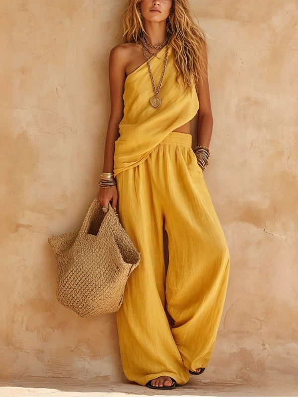 Elegant women's one-shoulder jumpsuit with a flowing wide leg, ideal for resort or party attire.