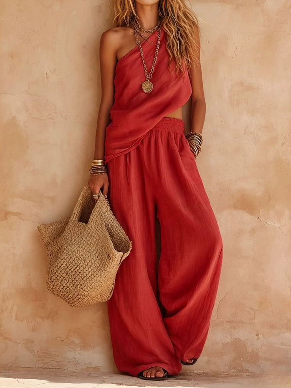 Chic women's one-shoulder wide-leg jumpsuit in a solid color, perfect for formal events or resort wear.