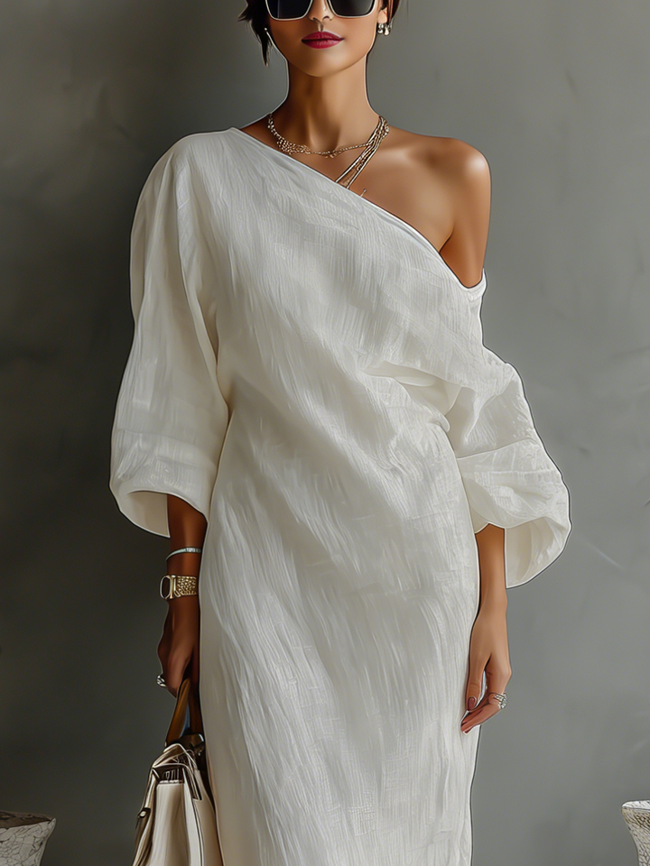 Elegant one-shoulder long sleeve flowing maxi dress, ideal for sophisticated formal events.