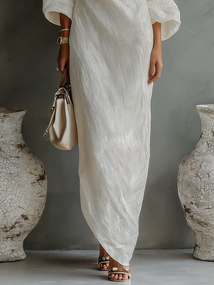 Women's formal one-shoulder flowing maxi dress in a chic design, suitable for elegant parties & events.