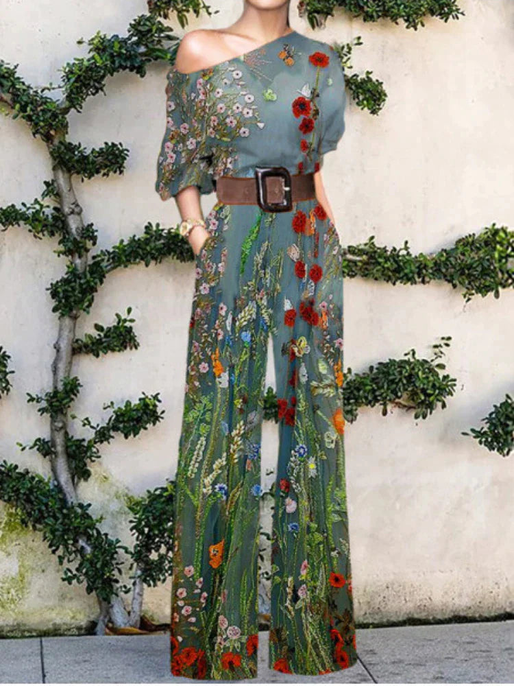 Stylish women's printed one-shoulder wide leg jumpsuit. A fashionable statement piece for elegant casual chic.