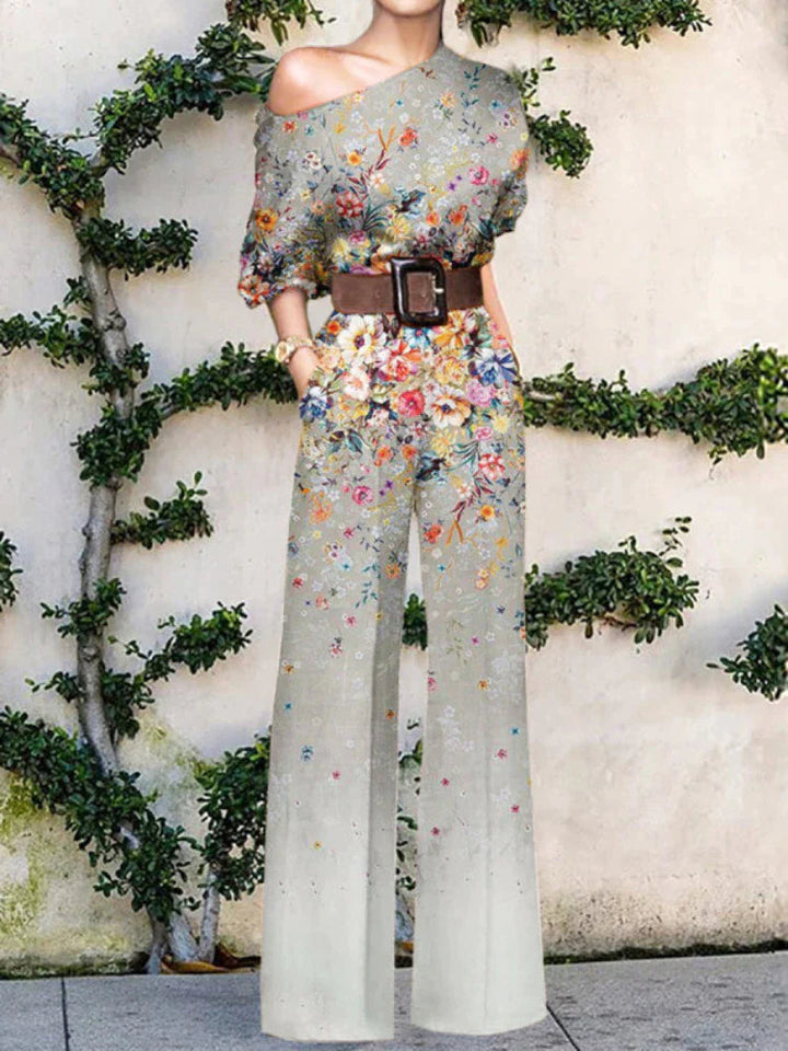 Fashionable women's one-shoulder jumpsuit featuring a unique print & wide leg design for vacation outfits.
