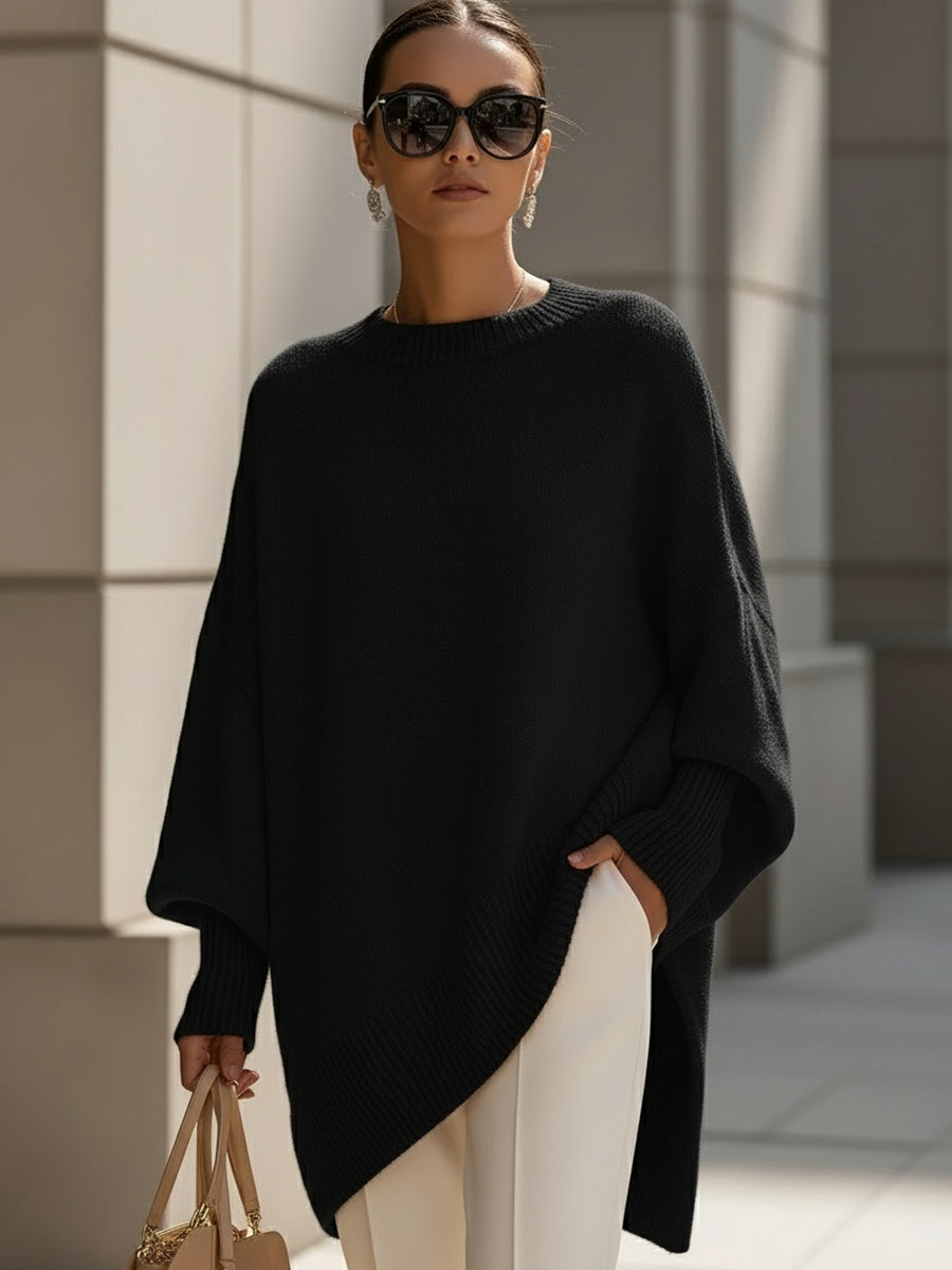 Elegant women's oversized cape sweater poncho, a versatile, chic, and comfortable layering piece for autumn.